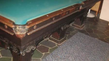 Before professional restoration, a Goodman-Leavitt-Yatter pool table
