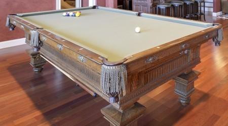 End view of a fully restored Jewel antique pool table