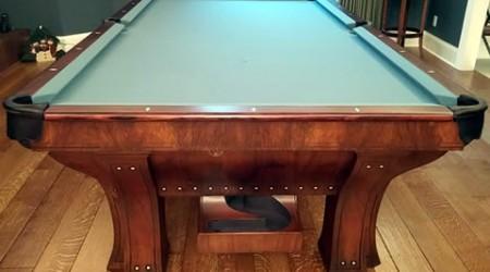 Corner pocket closeup of restored antique Marquette billiards table