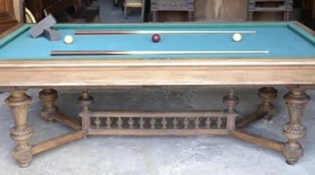 Prior to restoration, an antique pool table, The Marseille