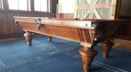 Side view of restored antique Brunswick Narragansett billiards table
