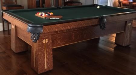 Fully restored antique Regina pool table positioned in a family home
