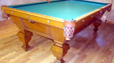 Restored antique billiards table with leather pockets, The Universal