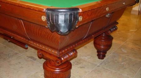 Corner pocket of antique Cambridge pool table