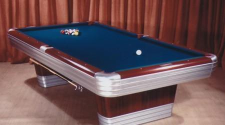 Lit display of antique Centennial billiards table
