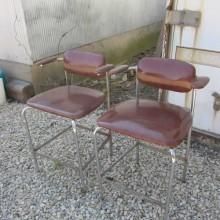 Front view of mid-century billiard chairs