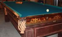 Damaged ExpoMadison antique billiards table