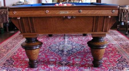 End view of a fully restored antique Brunswick Narragansett pool table