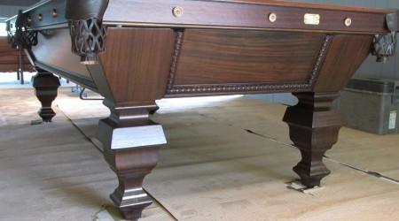 Professional restoration of an antique Universal pool table