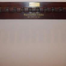 Top view of antique Brunswick Balke Collender billiard wall mount cue rack no 22